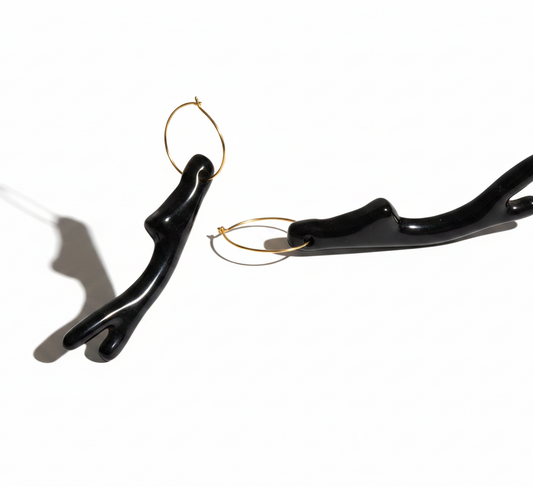 Cose E Bijoux Levanzo earrings featuring gold-plated 925 silver hoops with a black resin faux coral branch charm.