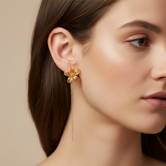 Cose E Bijoux Loulou gold flower drop earrings with delicate wire petals worn by a woman
