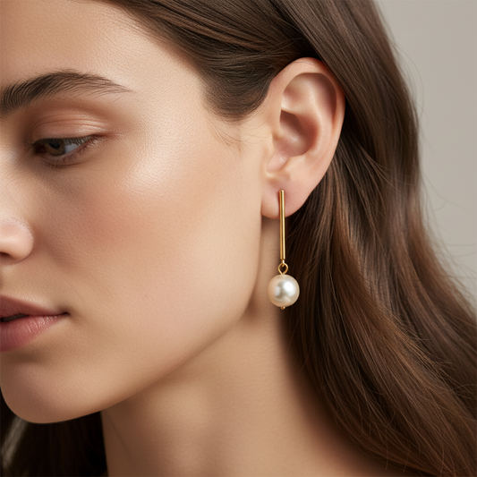 Cose E Bijoux Miriam gold-plated drop earrings featuring a white Majorca pearl on a delicate stick post.